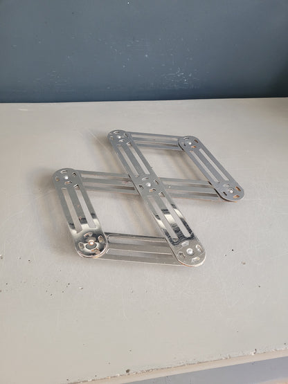 Dessous de plat articulé chromé  - Ref 604